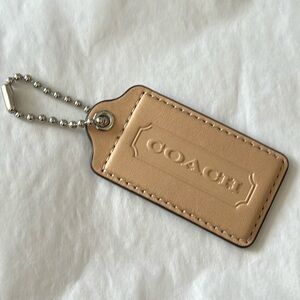 coach bag tag